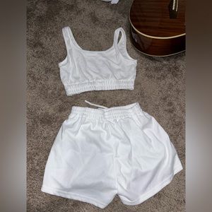 matching white set shorts and cropped tank. size small.